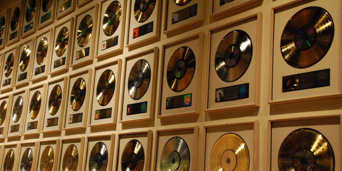 Wall of framed gold and platinum record awards